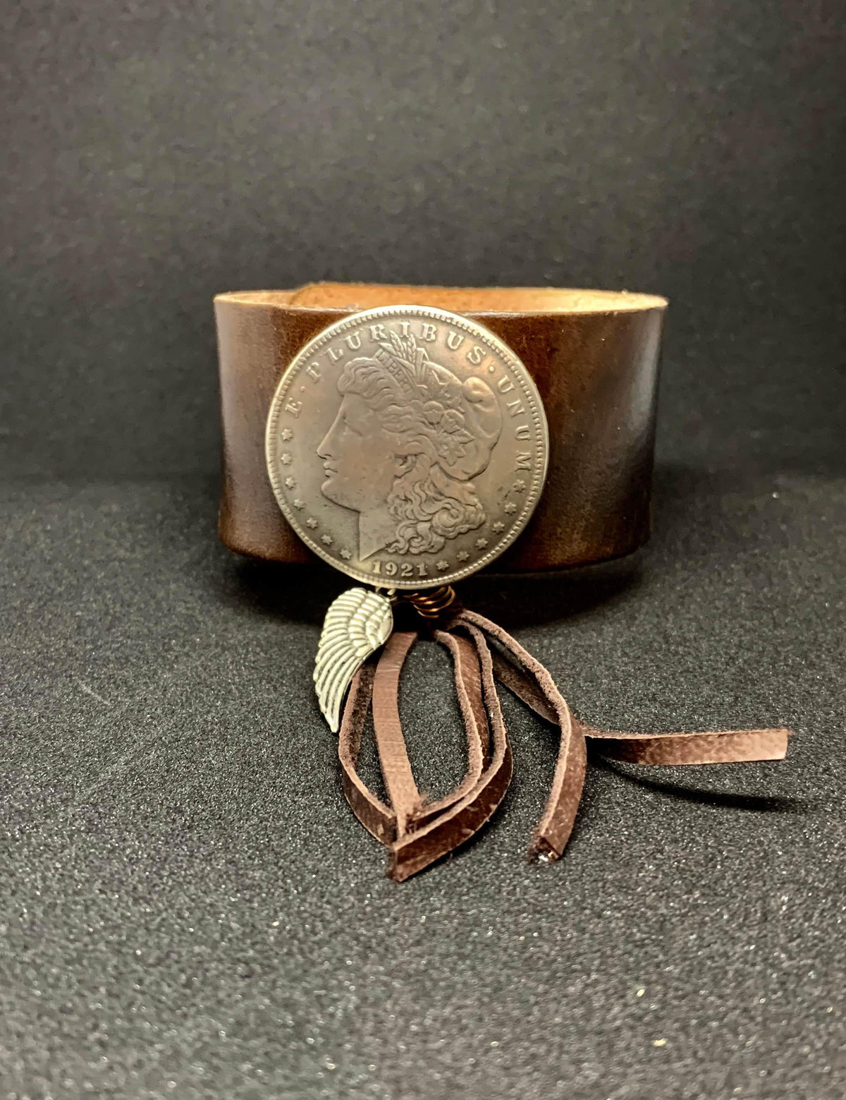 Leather silver dollar cuff